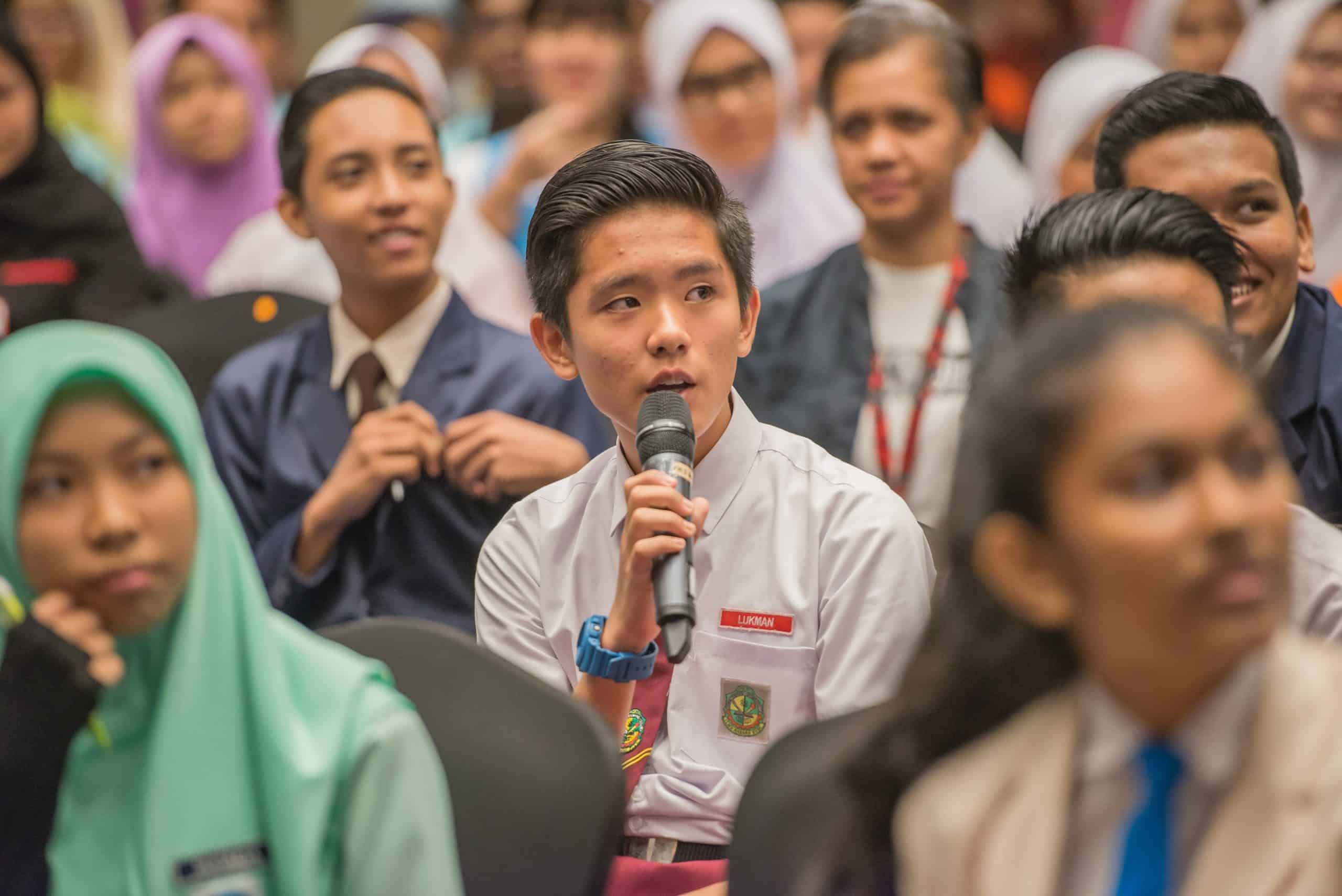 a boy asks a question during the Saya Sayang Saya youth townhall.