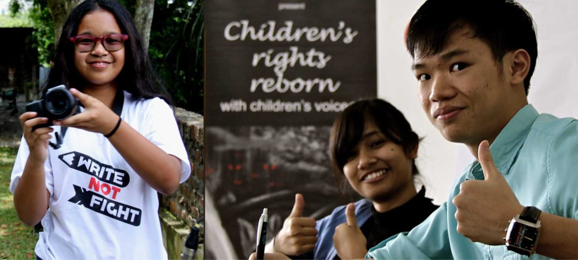 three children, one holding a camera and another two with the thumbs up sign.