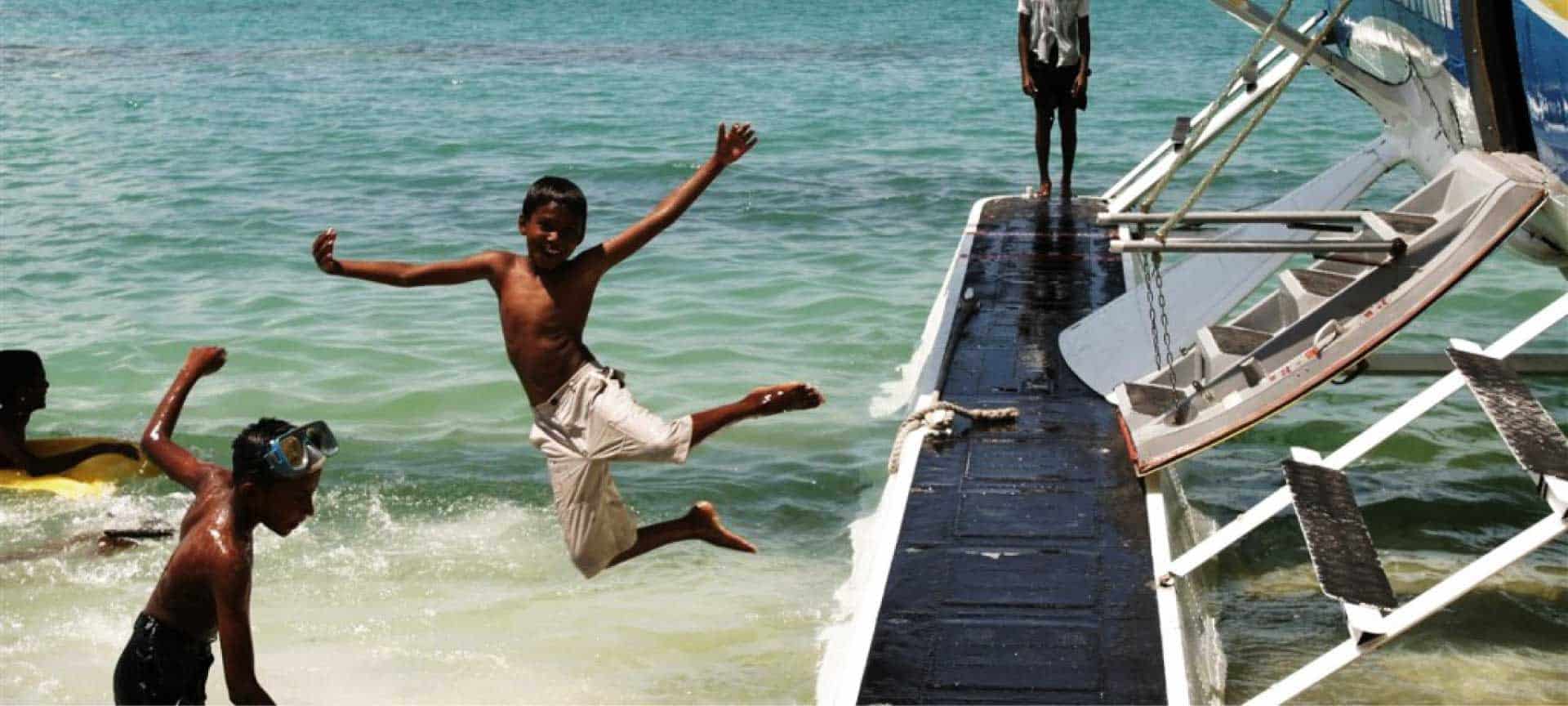 Boys playing in the sea.