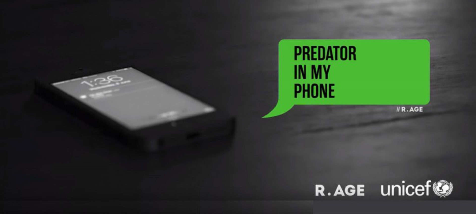 a phone on a table. Next to it a speech bubble with the words Predator in my phone. Below are the R.AGE and UNICEF logos.