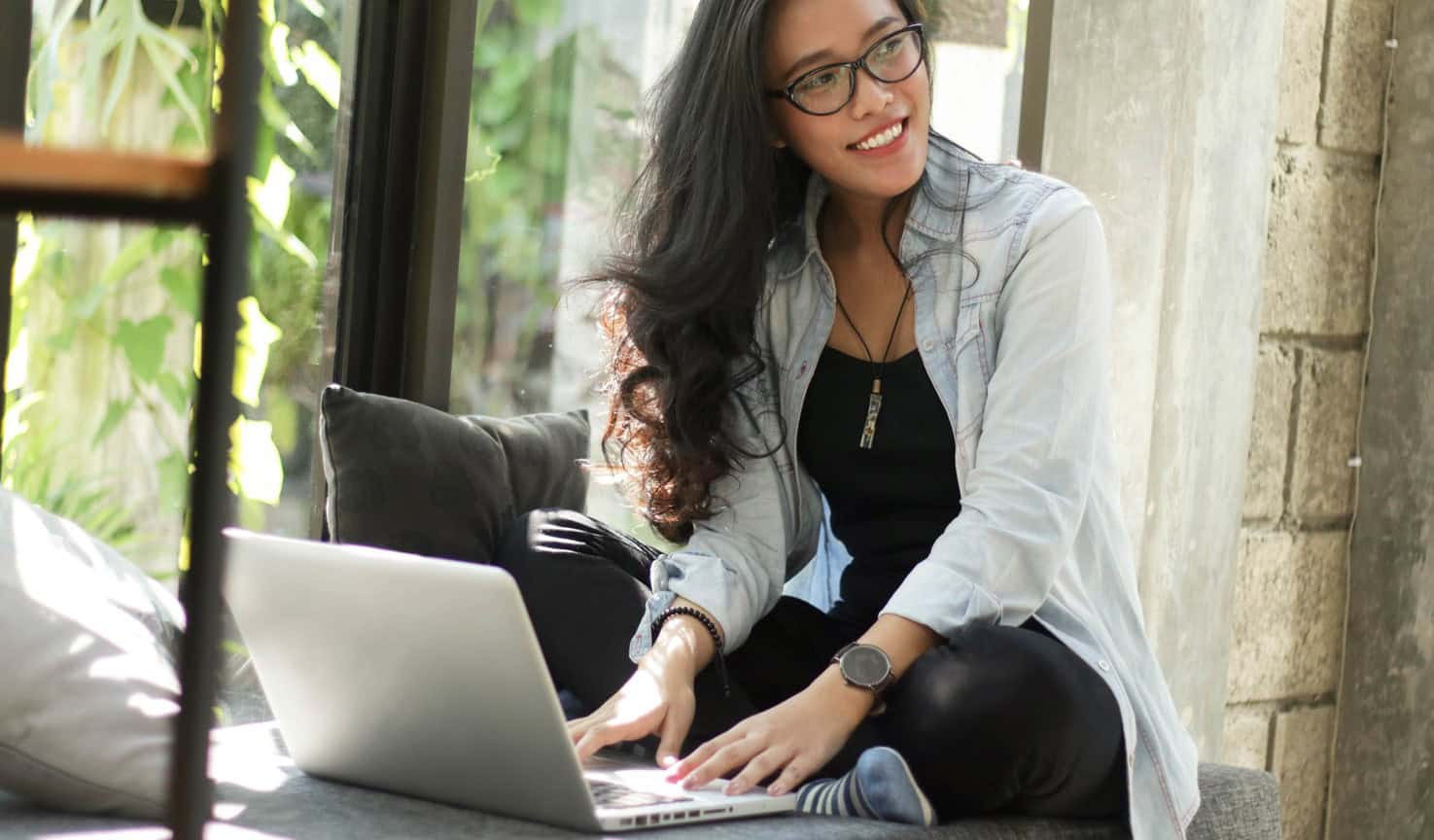 young woman sitting at her laptop.