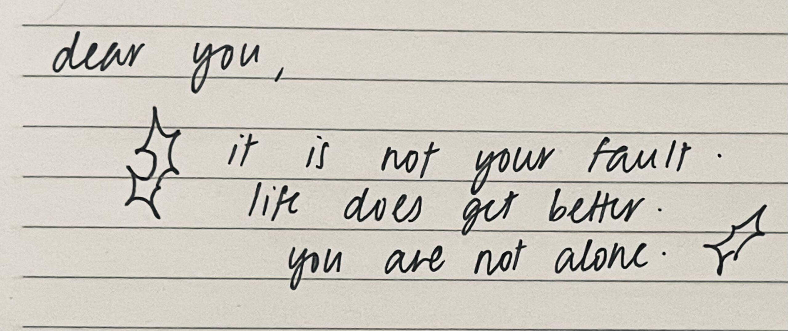 A handwritten message on a note paper.