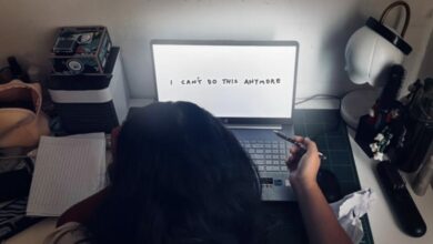 A young girl at her computer that shows text "I can't do this anymore."